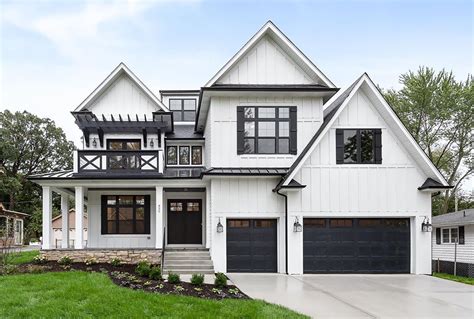 white farmhouse with black windows